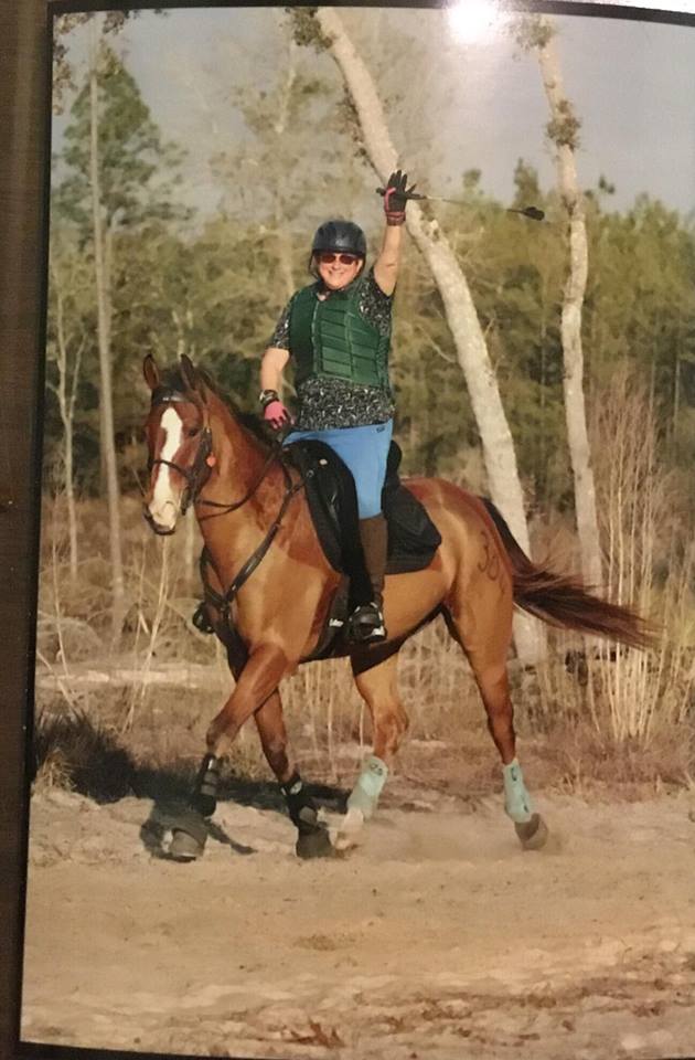 adopter riding brown rescue horse
